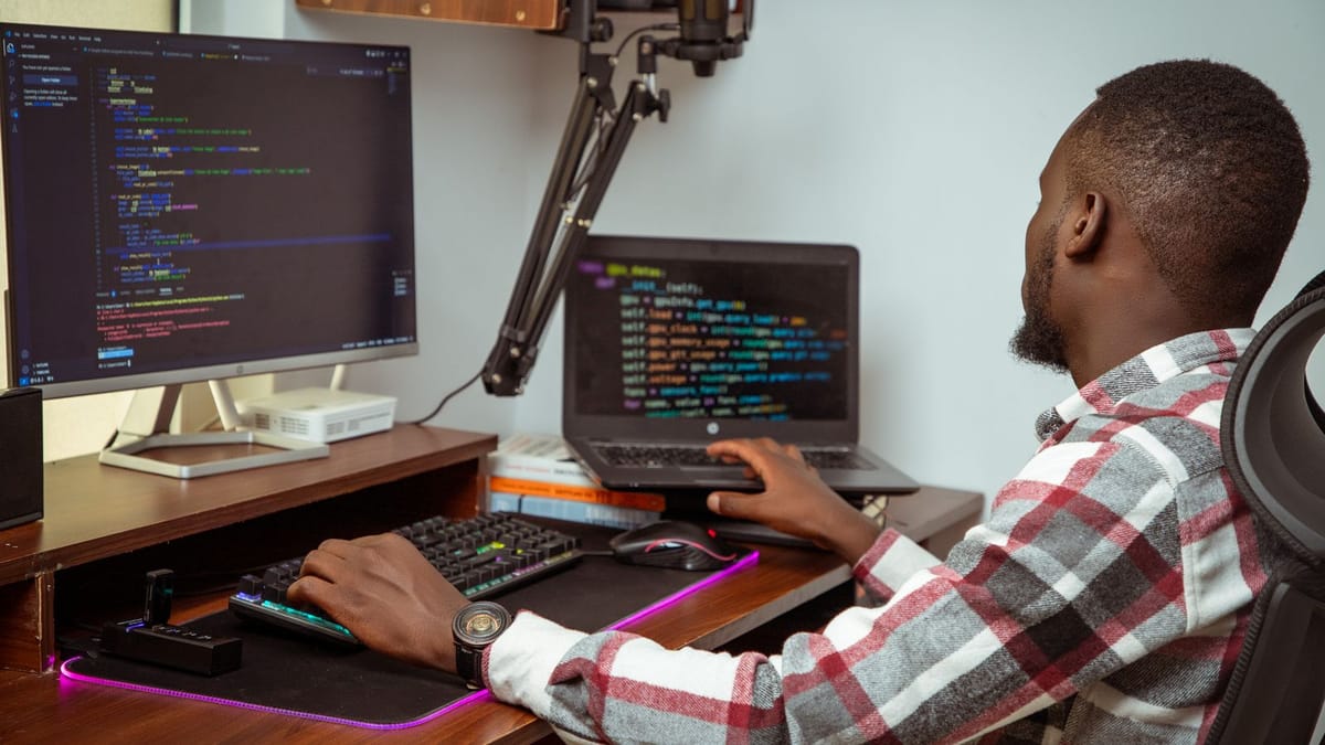 A developer working remotely at a home setup in Nairobi